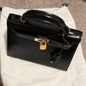 Elegant Black Handbag with Gold Accents